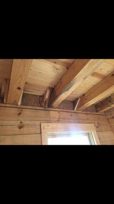 Water damaged beams used inside bedroom