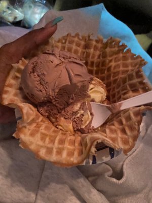 Raspberry ice cream and peanut butter ripple in a waffle bowl.