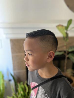 High fade, undercut, comb over on straight, thin hair.