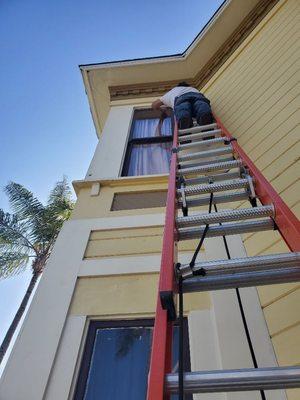 Swapping out broken glass panes from the second floor