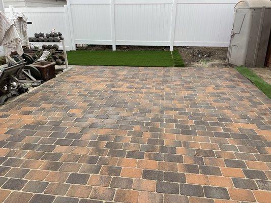 Pavers and artificial grass installation.