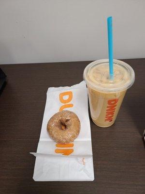 Blueberry glazed donut and caramel iced coffee