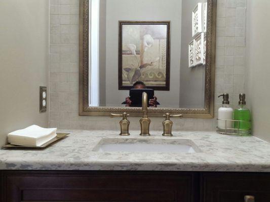 Add a custom countertop and sink along with cute accessories and BAM!  So much better!!  Please ignore the lady in the mirror!