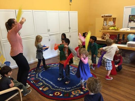 Music and Movement with Miss Ledah at circle time.