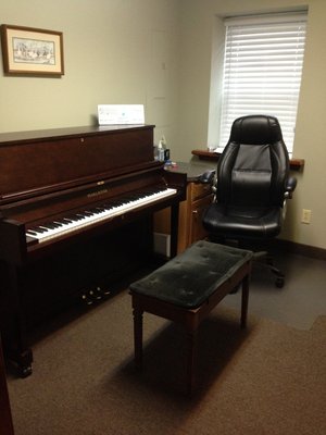 One of our piano rooms, housing an upright piano.