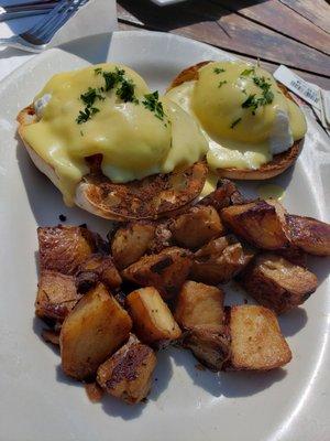 Eggs Benedict sans bacon with potatoes