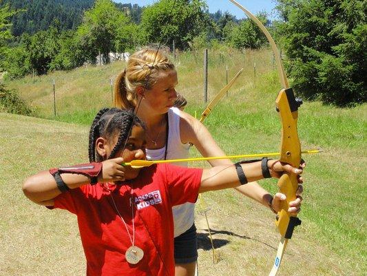 Learn the fundamentals of archery at Camp Tilikum Summer Camp.