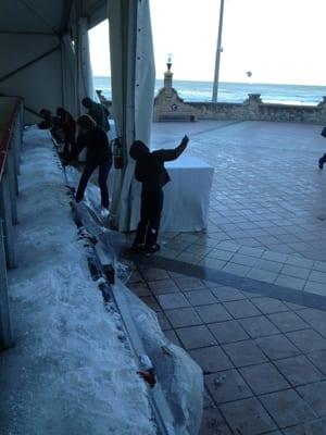 Kids (and adults) using the scraped off surface for snowballs... Hahaha!