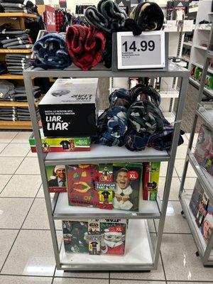 A Kohl's holiday clearance sale aisle display with Elf and Star Wars items.