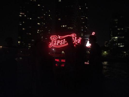 Sightseeing the Pepsi sign in Long Island City during a Corporate Party Cruise.