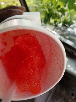 At the bottom of my cup a hard piece of ice. A retiree at a new snowball stand say as his  answer,  "what do you want me to do"