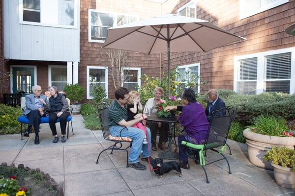 The Lodge is pet friendly and has two outdoor courtyards and sweeping patio. along the Harbor Bay Lagoon.