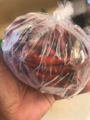 Large bag of red Thai chilis.