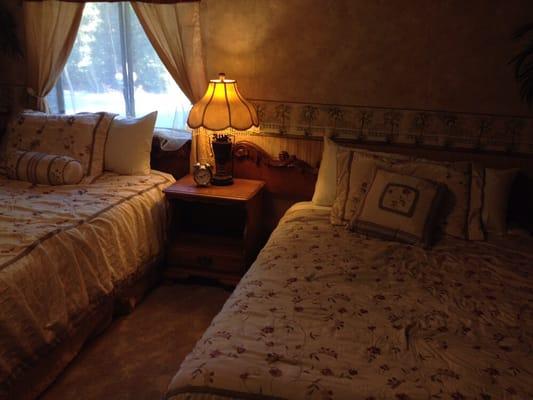 This is our Paradise room with one queen bed and one full bed.