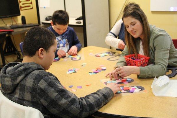 Making mittens during Occupational Therapy group