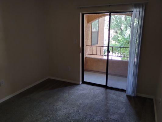 This bedroom connects to the separate patio.