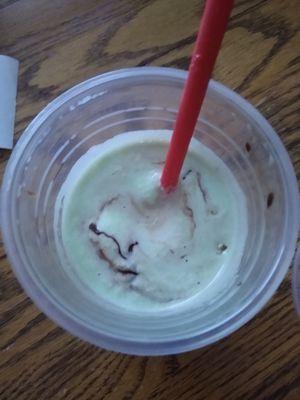 Chocolate mint shake without whip cream and already mixed and started to eat.