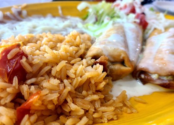 GRANDE BURRITO - Chimichanga ("Hard" & with Beef option) served w/ Rice and Refried Beans (Side option)