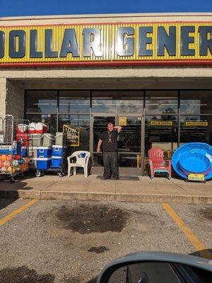 Here is the cashier who was (is) a complete coward.  Look at how he smoked a cigarette directly in front of the store entrance.