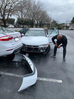 Donald inspecting the damage at the accident.