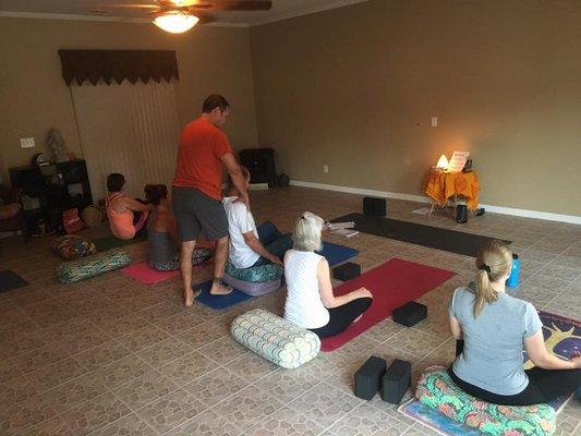 Dr. Troy teaching the community yoga and ergonomic exercises and stretches