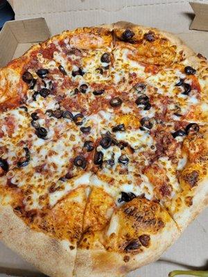 Bacon and black olive pizza.