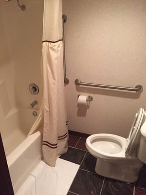 Nice bathroom including shower and tile floor.