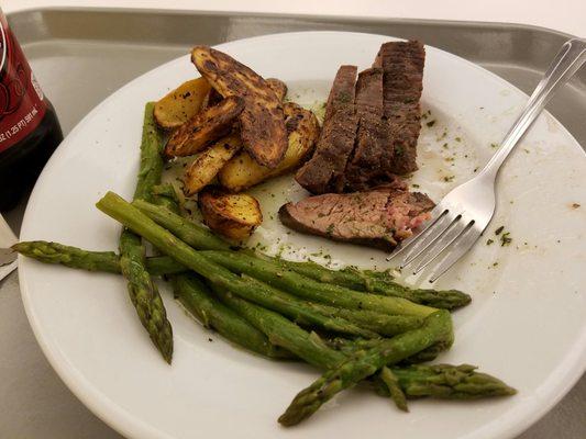 Flank Steak with a chimichurri sauce.  Amazing sides also!!