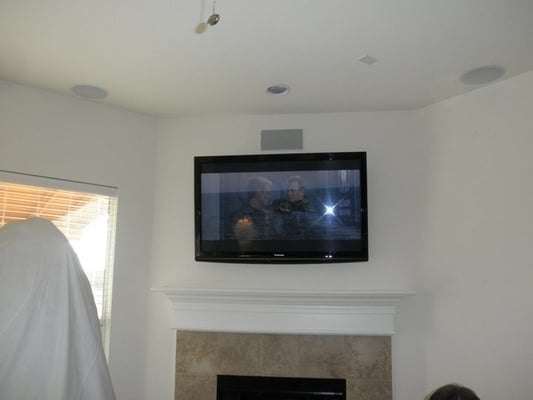 5.1 Dolby Digital in ceiling/wall speakers with fireplace mount.