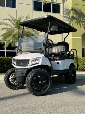 A white Sierra LSV AX1 four person electric golf cart currently for sale at our Miami dealership.
1835 NW 112TH Ave, Unit 181, Miami FL