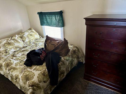 Unit 5, small upstairs bedroom; dresser blocks TV