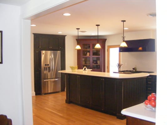 East end of kitchen after combining rooms and hall to make larger room. New hardwood floor. New lighting.