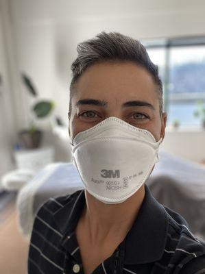 Rae wearing a NIOSH approved N95 mask at all times to help keep you healthy during your session.