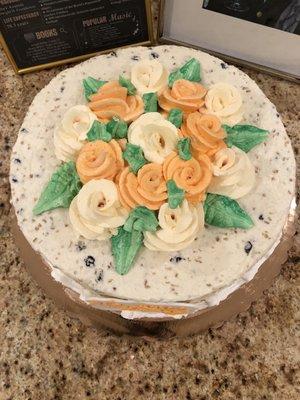 Carrot cake with bed of flowers