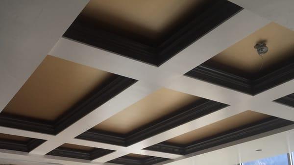 Metallic gold ceiling with stained and finished crown molding.