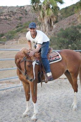 Patrick with a horse he was training.