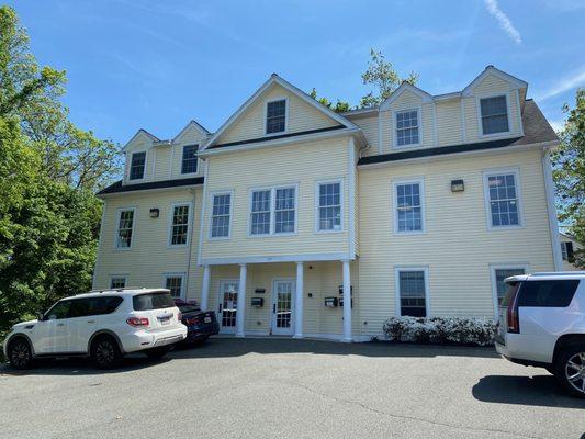 Parking lot and entrance to office (left door)