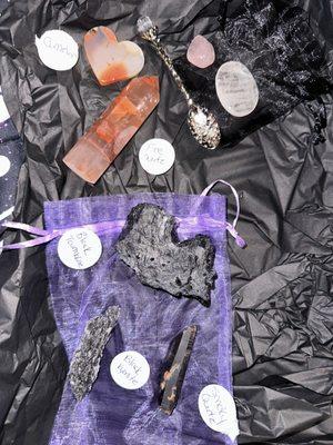 carnelian heart, fire quartz tower, rose quartz tumble, clear quartz worry stone, black tourmaline, black kyanite, & smoky quartz