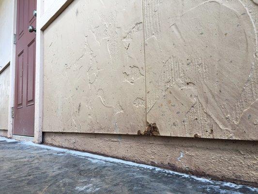 Wall gouged, cement splatter; Never fixed.