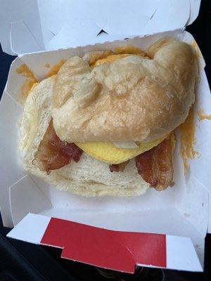 A bacon egg liquid cheddar cheese croissant