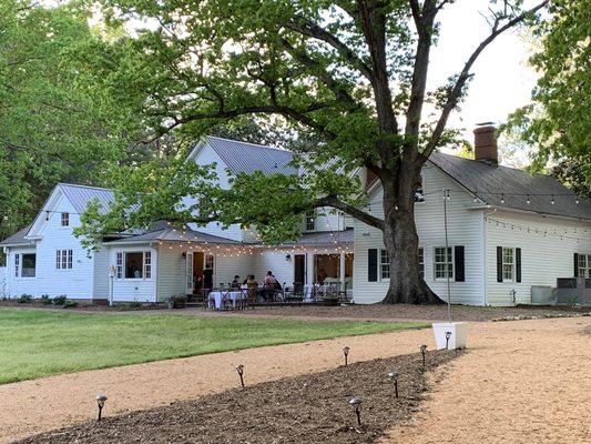 Back of the Old Lystra Inn with charming patio