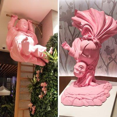 Hand sculpted, painted pink Buddha sculptures by Kihl Studios