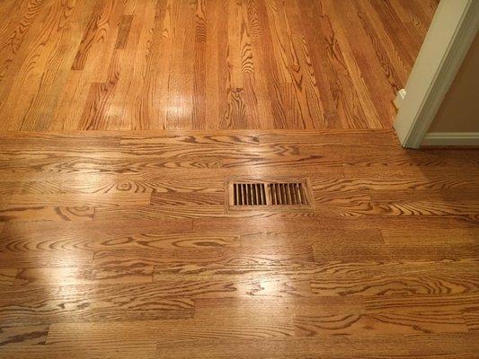 Sunroom into kitchen with new heat vent covers.