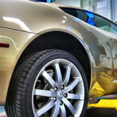 An Aston Martin DB9 on the lift at New Tickford Street Service.