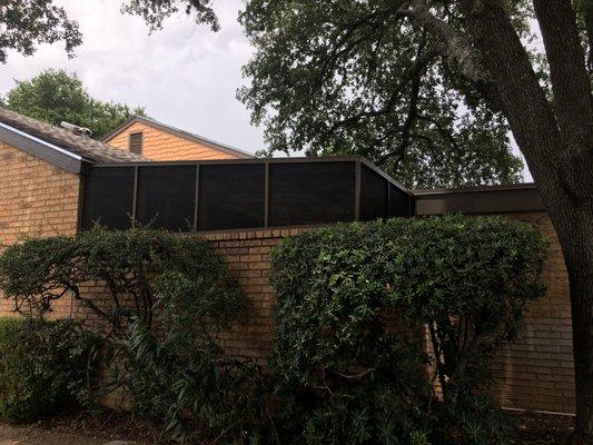 Installed a screened in patio and painted it brown