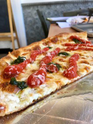 The perfect slice: cheese, marinara and basil!