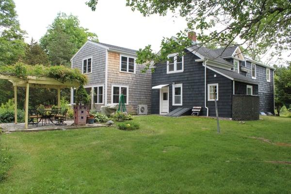 This fabulous expanded farmhouse on over an acre.