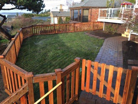 Landscape design and completion of fencing, new sod, and paver walkway in Seattle