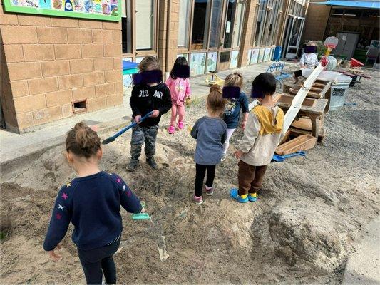 Sand pit with a water ramp.