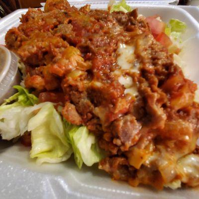 4 Fellas cheese steak salad closeup, DELISH! Made of Chipped beef, cheese, sauce, hot peppers, sweet peppers and onions.